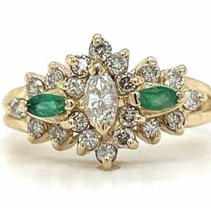 Stunning vintage inspired diamond and emerald engagement ring